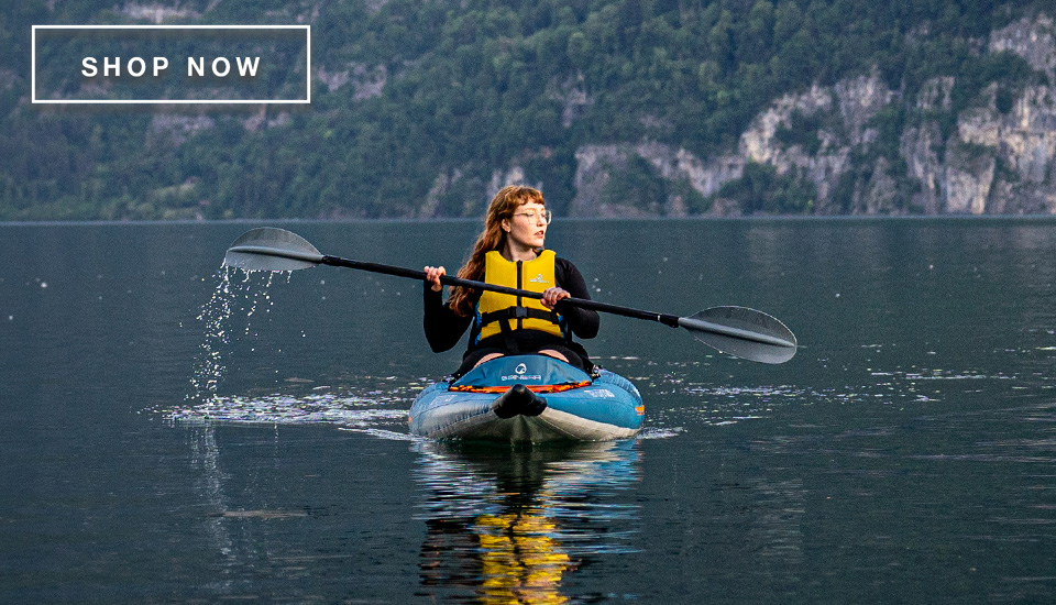 woman in a kayak on a lake